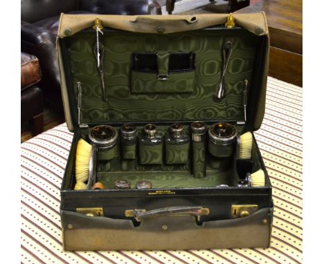 A gentleman's good quality green morocco leather travel-case by Wilson & Gill of Regent St., London, fitted with a quantity o