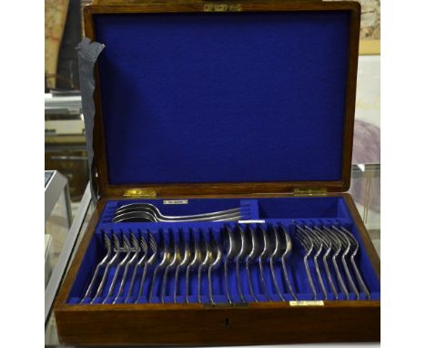 A Walker & Hall oak canteen of silver flatware for six, 28 pieces including four tablespoons, mostly Sheffield 1927, four sou