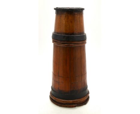 An antique coopered stick stand of tapering gun barrel form, 55 cm high x 18 cm to 25 cm diam