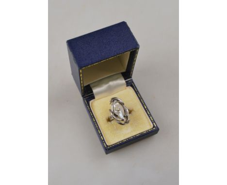 A contemporary ring set with baroque shaped freshwater pearl and diamond, 18ct white gold