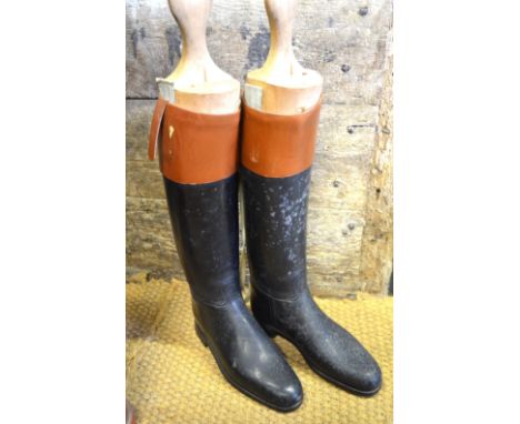 Two pairs of vintage leather hunting boots with tan leather cuffs, c/w sectioned wooden boot trees, one pair with trade label