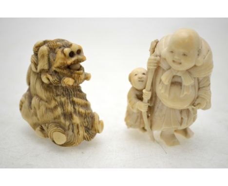 A Japanese ivory netsuke of a Shi Shi, 4 cm h. to/w a Japanese ivory okimono of Ho Tei carrying his sack on his back accompan