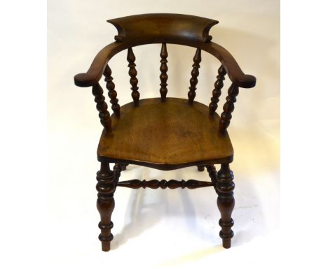 A late 19th /20th century bow elbow chair with bobbin turned frame