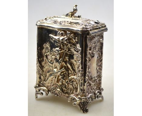 An Edwardian rococo revival silver tea caddy in the manner of Paul de Lamerie, richly chased in the chinoiserie manner with a