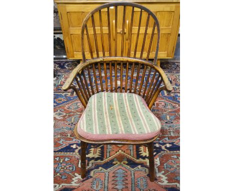 A 19th century elm and fruitwood stick back Windsor elbow chair Condition Report Damage includes back legs replaced, old worm