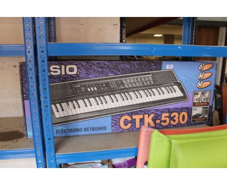 A CASIO ELECTRIC KEYBOARD IN BOX