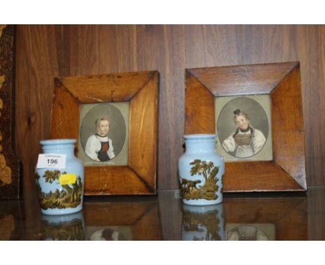 TWO BURR WALNUT FRAMED PORTRAITS TOGETHER WITH A PAIR OF VICTORIAN LOZENGE STAMPED HUNTING SCENE VASES 