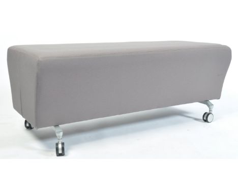 Orangebox - Model Gate-01 - A contemporary two seat bench having a grey taupe upholstered and padded body with Orangebox lini