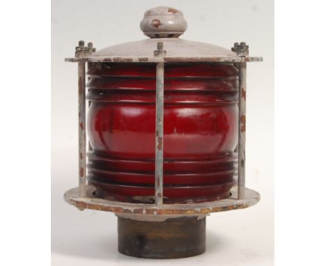 An early 20th Century retro vintage port ships / boat lantern light lamp having a ribbed red glass diffuser globe with painte