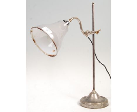 A vintage 20th Century vintage industrial bridge lamp having a porcelain enamel two tone conical shade supported by a swan ne