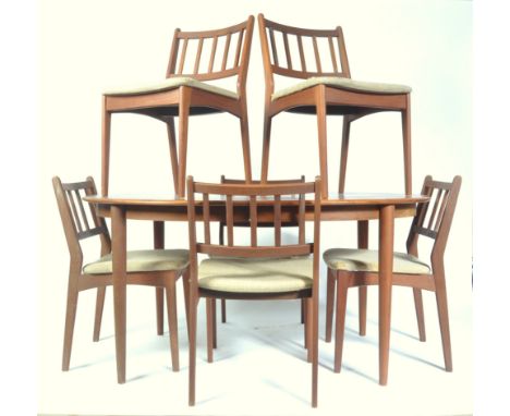 A large 20th Century Danish retro vintage teak wood dining suite comprising of a oval extending dining table&nbsp;with two ex