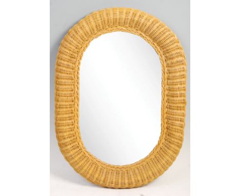 An original retro vintage 1970's wicker framed wall mirror. Oval mirror, with a hand woven domed wicker frame. Hanging points