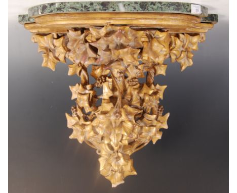 A 19th century gilt wood and green veined marble console table. The gilt wood carved base with stunning acanthus leaf and vin