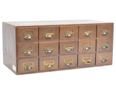 An early 20th Century antique vintage industrial oak 15 drawer index filling cabinet having brass ' D ' cup handles and index