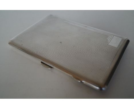 Art deco silver cigarette case, engine-turned decoration with vacant cartouche and gilt interior, Birmingham, 1935, Frederick