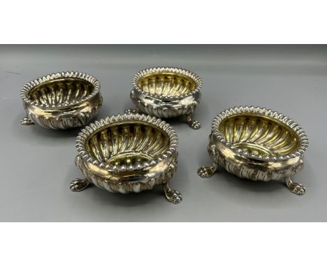 A set of four George III silver salts of lobed form, each with three paw feet, sheffield 1813, makers Samuel Roberts, George 
