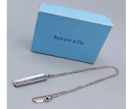 Tiffany and Co. a Sterling silver pendant of shaped ingot form with matching linked chain complete with Tiffany box 
