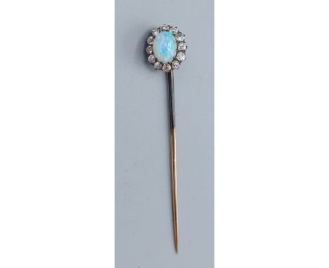 An oval opal and diamond cluster set stick pin 