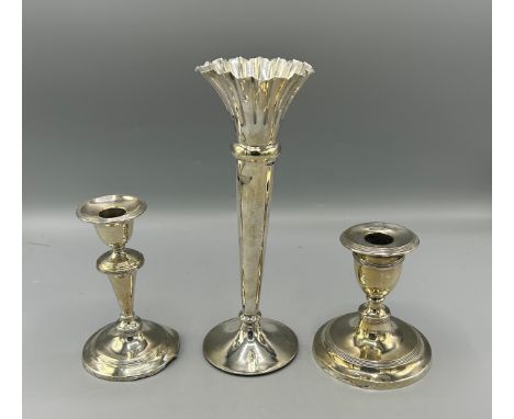 A silver flared rim specimen vase together with two Birmingham silver dwarf candlesticks 