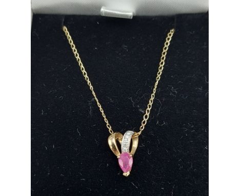 A 9ct gold Ruby and Diamond set pendant together with a 9ct gold chain with box 