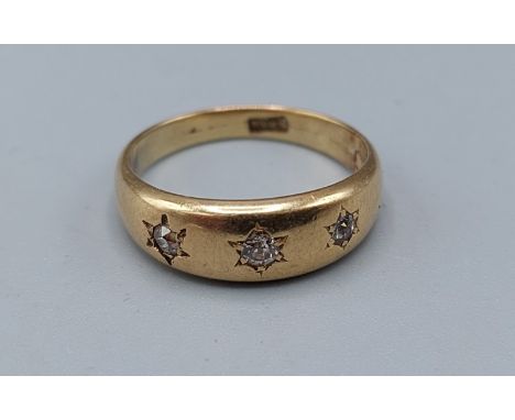 A yellow metal three stone Diamond ring, 2.5gms, ring size K 