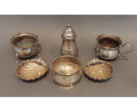 A Chester silver pepper together with a pair of Sheffield silver salts of scallop form and three silver salts, 5ozs 