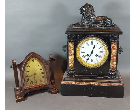 A Victorian slate and marble mantel clock with lion surmount and two train striking movement together with a Newhaven mantel 