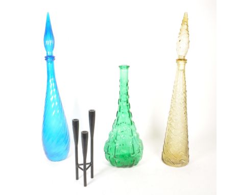 Three mid century Italian Empoli coloured glass genie bottles with a metal candlestick holder. Comprised of a green example, 