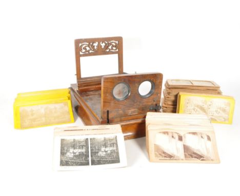 A 19th century Victorian mahogany stereoscope viewer, alongside a large collection of 19th and 20th century stereoscope slide