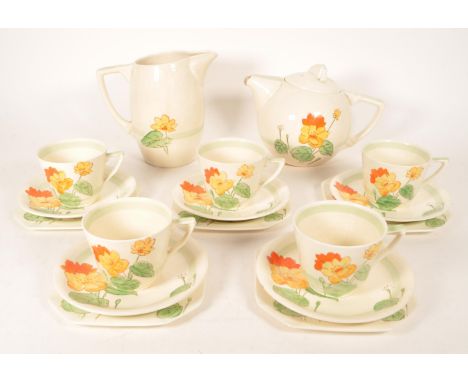 Midwinter - Mid 20th century art deco style tea service comprised of a teapot, teacups, saucers and side plates. Decorated wi