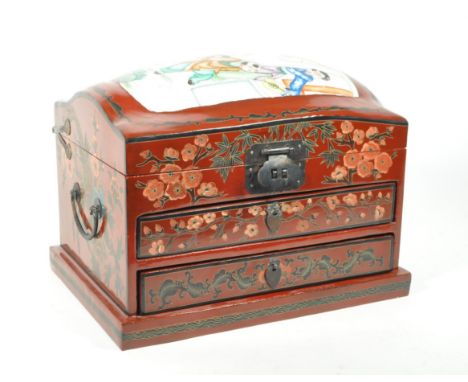 Early 20th century vintage Chinese red lacquered twin handled jewellery box. Box includes a hinged lid opening to reveal a mi