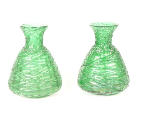 Manner of Loetz - Two 20th century art nouveau style green glass vases / bottles. Featuring a strapped design to the exterior