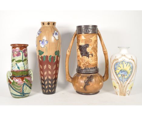 Four 20th century pottery vases. Comprised of an early 20th century Bretby twin handled vase, model no 1343, an art nouveau s