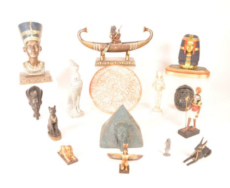 A collection of modern commemorative giftware Egyptian tableware ornaments. Including a resin Cleopatra bust, a resin Neferti