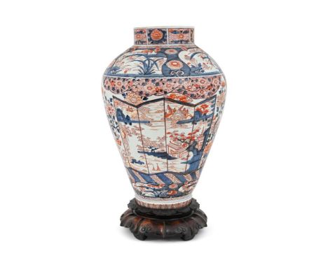 A LARGE IMARI VASE EDO PERIOD, EARLY 18TH CENTURY On a carved wood base 72cm high overall  Condition Report:  Presents well. 