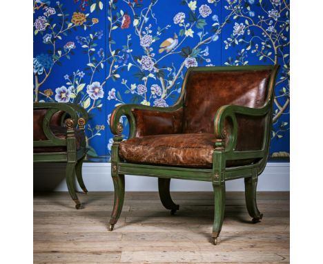 A PAIR OF GREEN PAINTED, PARCEL GILT AND LEATHER UPHOLSTERED ARMCHAIRS IN THE MANNER OF HENRY HOLLAND, LATE 19TH OR EARLY 20T