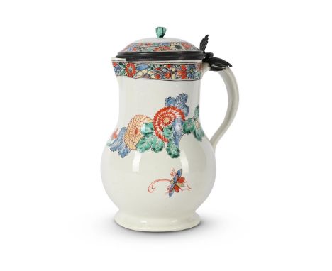 A METAL-MOUNTED CHANTILLY KAKIEMON EWER AND HINGED COVER FRANCE, CIRCA 1740 of typical form with loop handle and sparrow beak