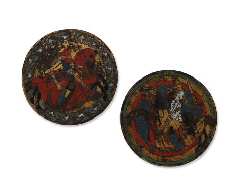 TWO CIRCULAR ANGLO-GALLIC ENAMEL ROUNDELS  14TH CENTURY OR LATER  Each with a fully caparisoned jousting knight; charging lef