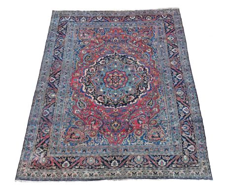 A LARGE KIRMAN CARPET approximately 600 x 440cm  Condition Report:  Carpet with significant wear throughout. Surface dirt and