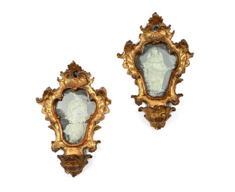 A PAIR OF CARVED GILTWOOD AND REVERSE ETCHED GLASS MIRRORS  ITALIAN, EARLY 18TH CENTURY  With a largely illegible inscription