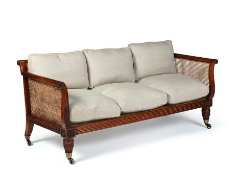 Y  A REGENCY ROSEWOOD AND CANED SETTEE CIRCA 1820 With loose upholstered cushions. The castors stamped 'I. W. Lewty's Patent'