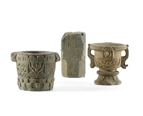 A GROUP OF CARVED STONE  To include  A George I carved stone pestle, dated 1729 and initialled MD, 26.5cm high, 35cm wide:  A