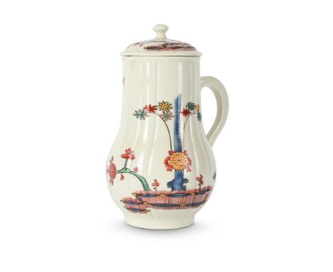A ST. CLOUD PORCELAIN MILK-JUG AND COVER CIRCA 1740 Of fluted baluster form, painted in the Kakiemon style with trailing plan
