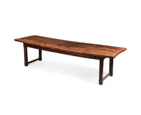 A LARGE BEECH, ELM AND OAK REFECTORY TABLE EARLY 19TH CENTURY One long frieze with a pull out chopping board 78.5cm high, 299