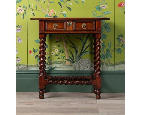 A RARE CHARLES II YEW WOOD SIDE TABLE CIRCA 1670 The cleated top above a double moulded frieze drawer, with barley twist fram