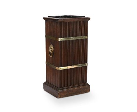 A WILLIAM IV OAK AND BRASS BOUND STICK STAND  CIRCA 1835 Four division interior, lion mask ring handles to the sides  61.5cm 