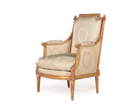 A LOUIS XVI GILTWOOD AND UPHOLSTERED BERGERE  BY ADRIEN-PIERRE DUPAIN, CIRCA 1780 The underside of the rail stamped 'A.P. DUP