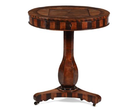 A RARE IRISH KILLARNEY ARBUTUS AND YEW WOOD GAMES TABLE  CIRCA 1830-1840  With radial veneered reversible drop in top with ch