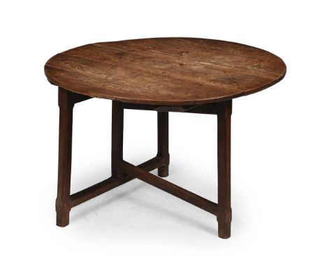 A GEORGE III OAK FOLDING CRICKET TABLE PROBABLY WELSH, LATE 18TH OR EARLY 19TH CENTURY With a hinged top, the fixed trestle e