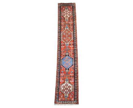 A HERIZ RUNNER  Of narrow proportions  approximately 426 x 80cm  Condition Report:  Runner with some wear overall consistent 